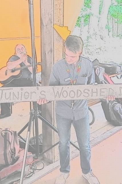 Will unveils the resurrected Junior's woodshed sign.  A good time was had by all.  