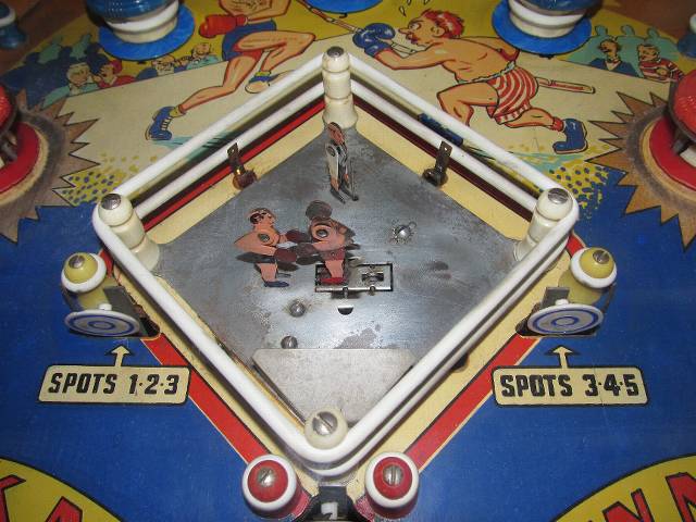 Extremely cool!  Little mechanical boxers would have a fight, based on which targets you'd hit on the playing field.  This  50's vintage machine is truly an amazing example of pinball art. 