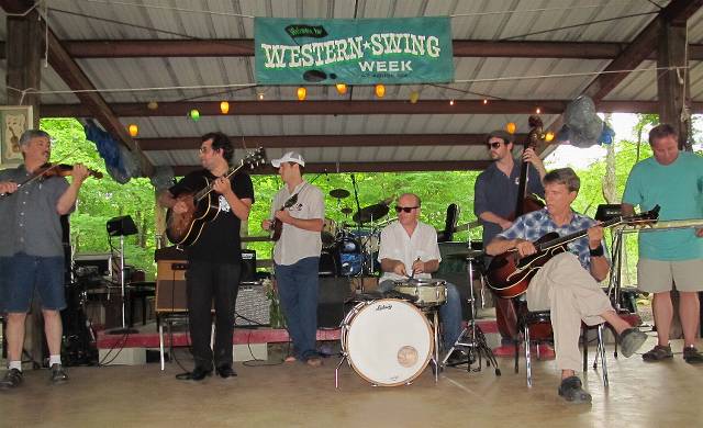  These intro demonstrations had the distinctive photographic advantage of not having mic stands in front of everyone!  James, Chas, Daniel, Glenn, Eric, Tom, Gerald.