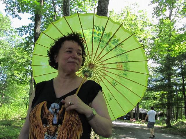 Olivia and her Olive umbrella.  Looking kind of like one of those fancy drinks in a Chinese restaurant :-)