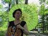 Olivia and her  Olive umbrella.  Looking kind of  like one of those fancy drinks in a Chinese restaurant :-)